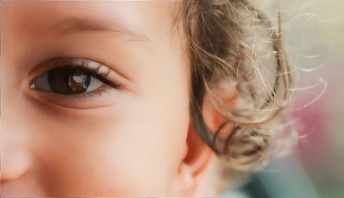 a close up of a child's brown eyes